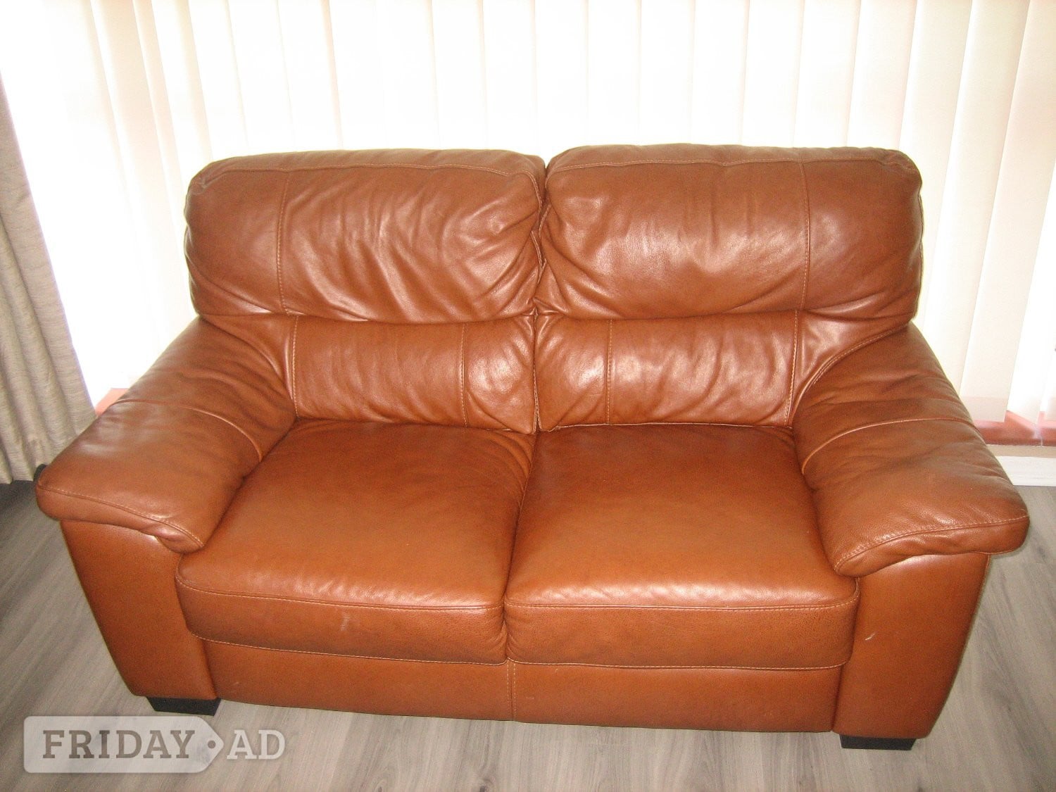 Leather two-seater sofa. 