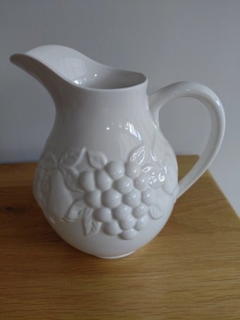 White Ceramic Jug with Fruit Embossing – Good Condition