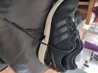 Female Adidas black trainers 