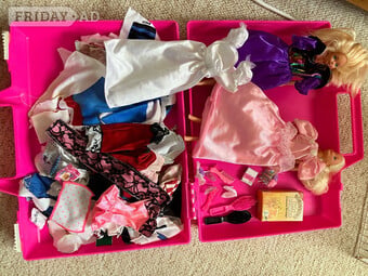 Two Barbie Dolls, multiple outfits & storage case