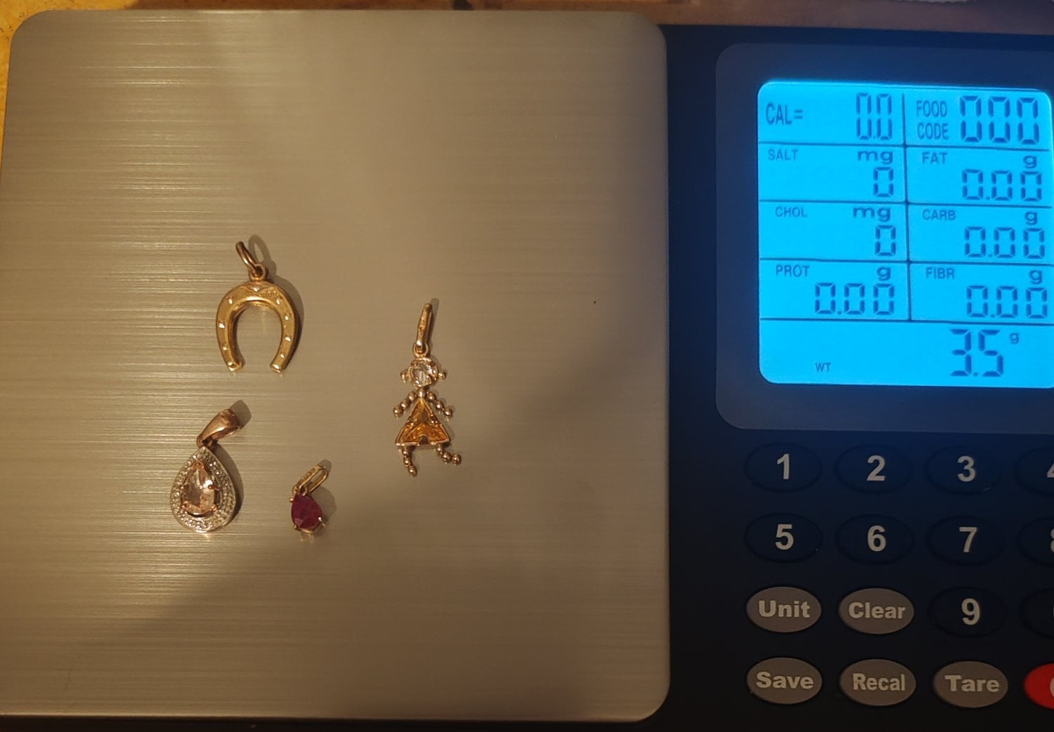 Job lot of 9ct gold pendants and charm  in Cranbrook