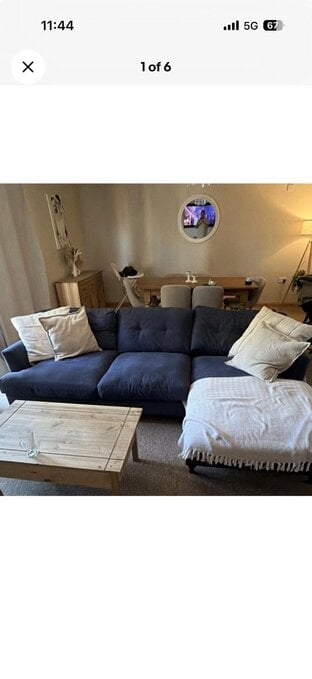 DFS large chaise 4 seater sofa and cuddled in navy blue 