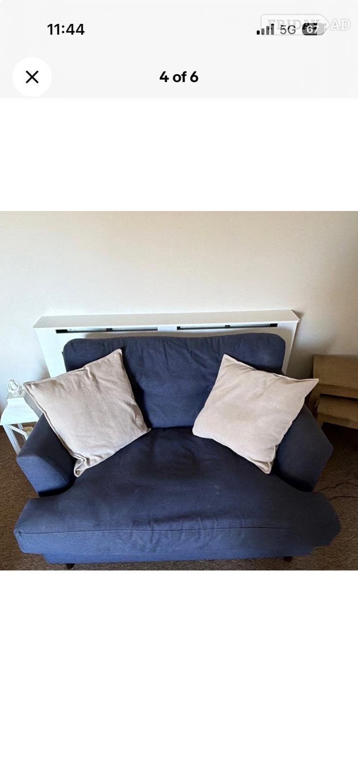 Peacehaven DFS large chaise 4 seater sofa and cuddled in navy blue 