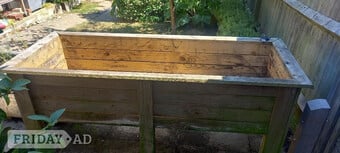 Large wooden trough for planting