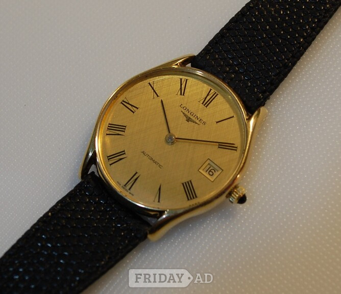 Longines gentlemans 9ct solid gold wristwatch.
