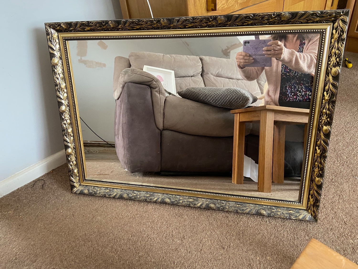 A large glass mirror your sitting room
