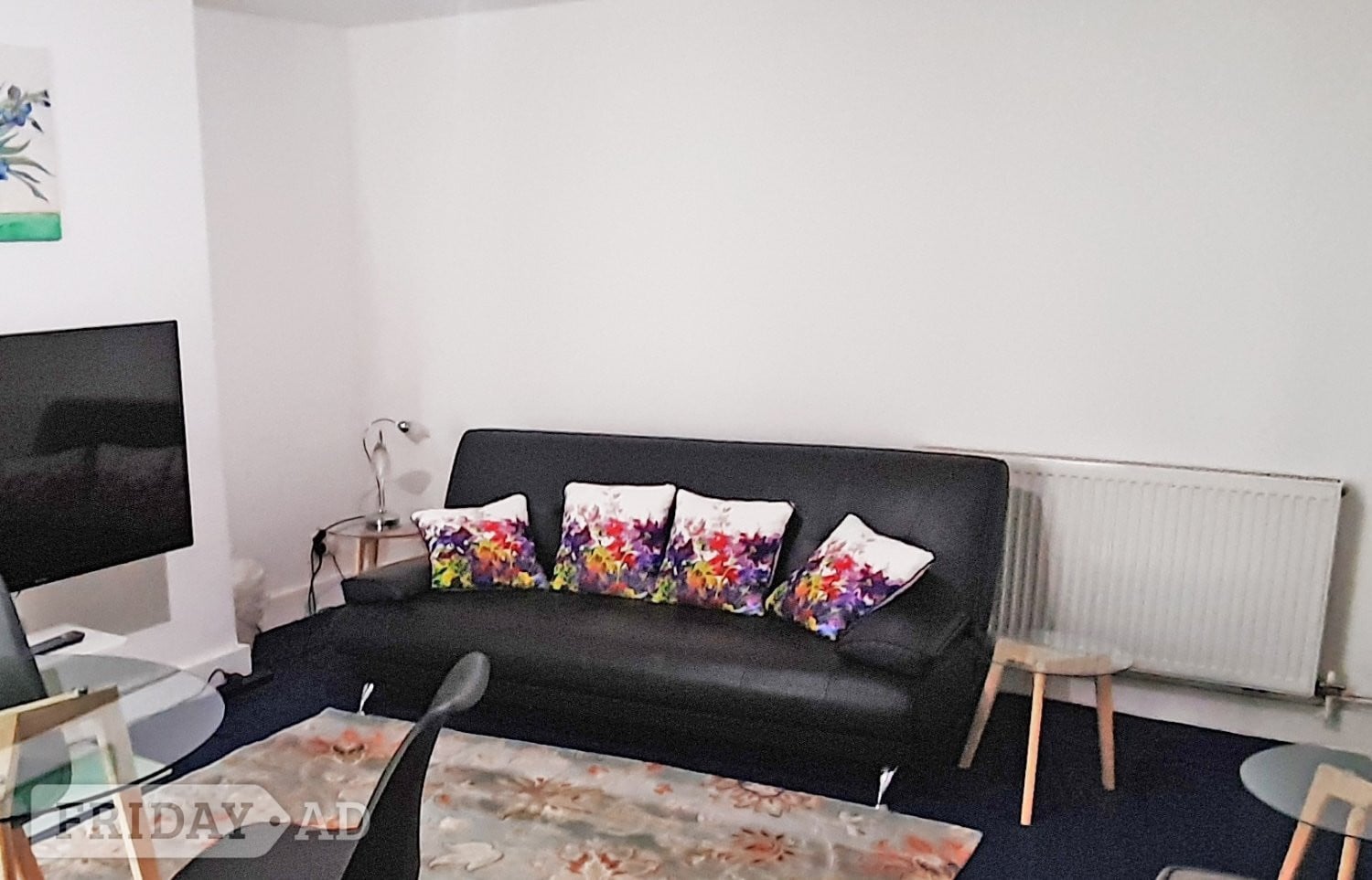 BLACK FAUX LEATHER SOFA-BED IN GREAT CONDITION - FREE TO COLLECT