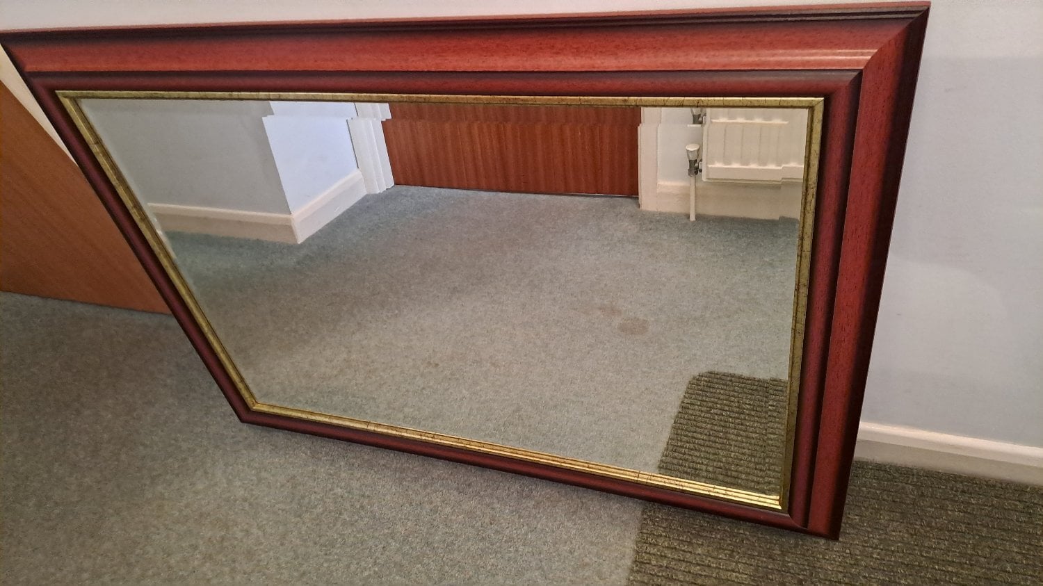 Wall hanging wood framed mirror in Lewes