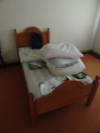 Bed. Single solid pine bed with headboard and mattress