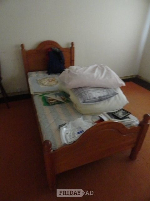 Bed. Single solid pine bed with headboard and mattress in Lancing