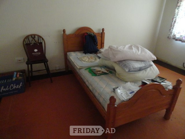 Bed. Single solid pine bed with headboard and mattress