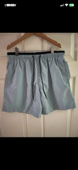 H&M turquoise swimming shorts in size medium