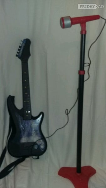 Toy guitar with microphone and stand