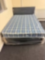 Rotherham Double Economy Mattress with black divan base and headboard