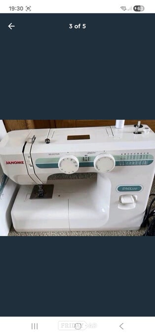 Janome DMX 200 sewing machine in new condition throughout 