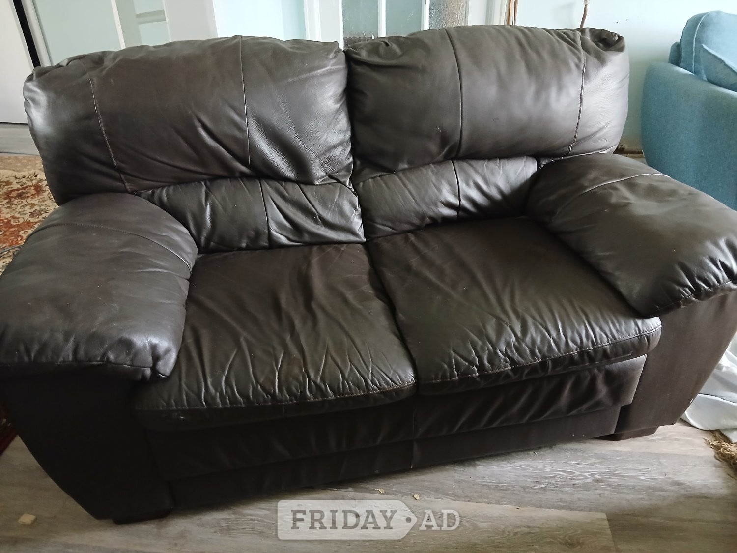 Brown leather two seater sofa
