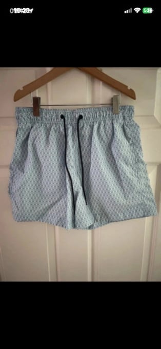 H&M light blue/white swimming shorts in size small