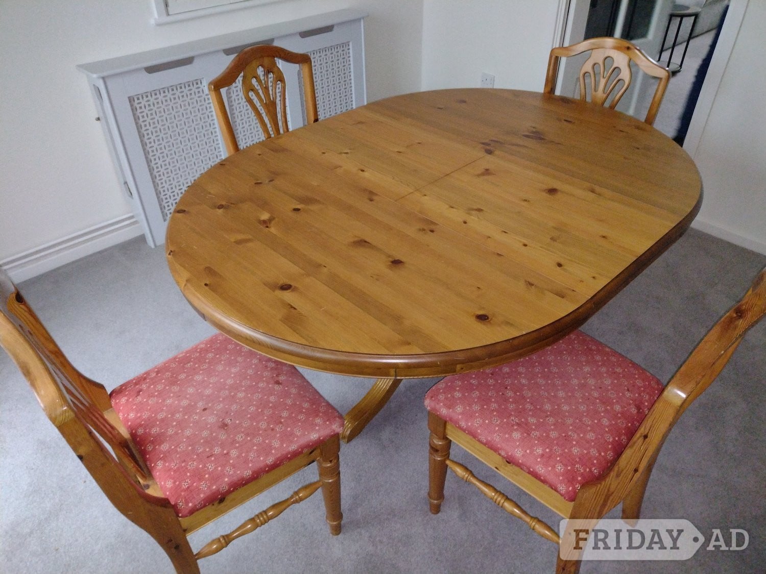 Ducal Victoria pine extending dining table with pedestal base.
