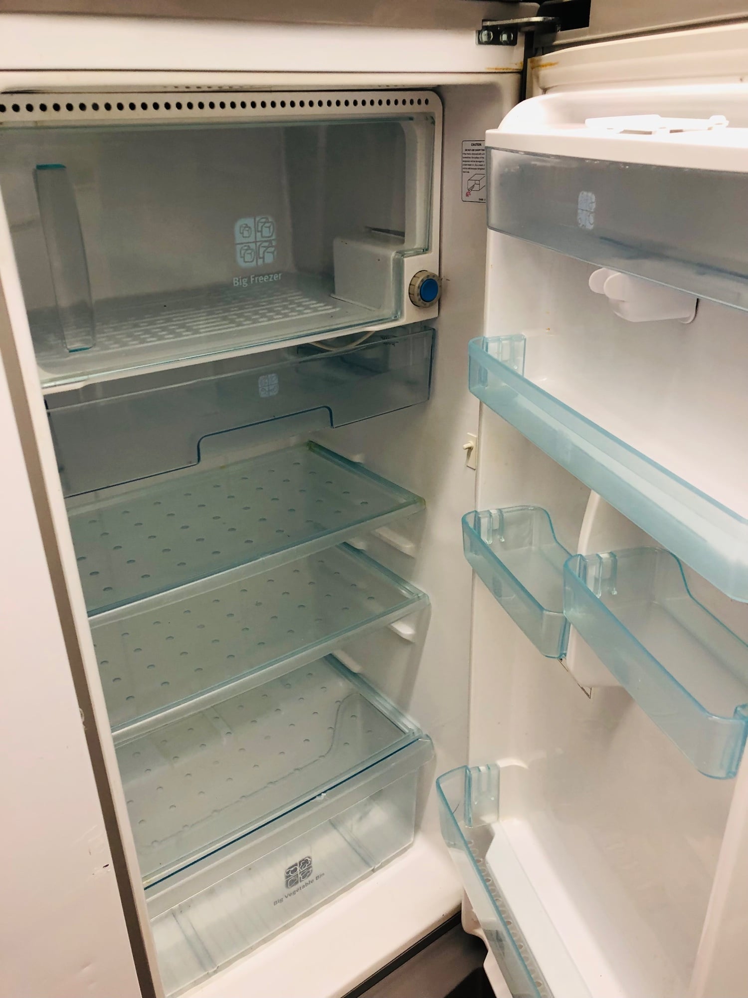 Samsung fridge with ice box and water dispenser .