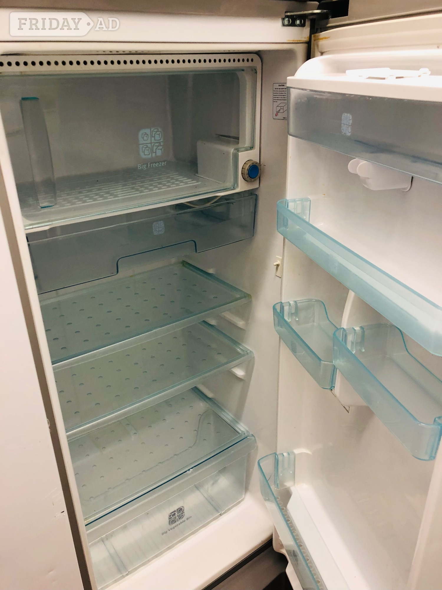 Samsung fridge with ice box and water dispenser .