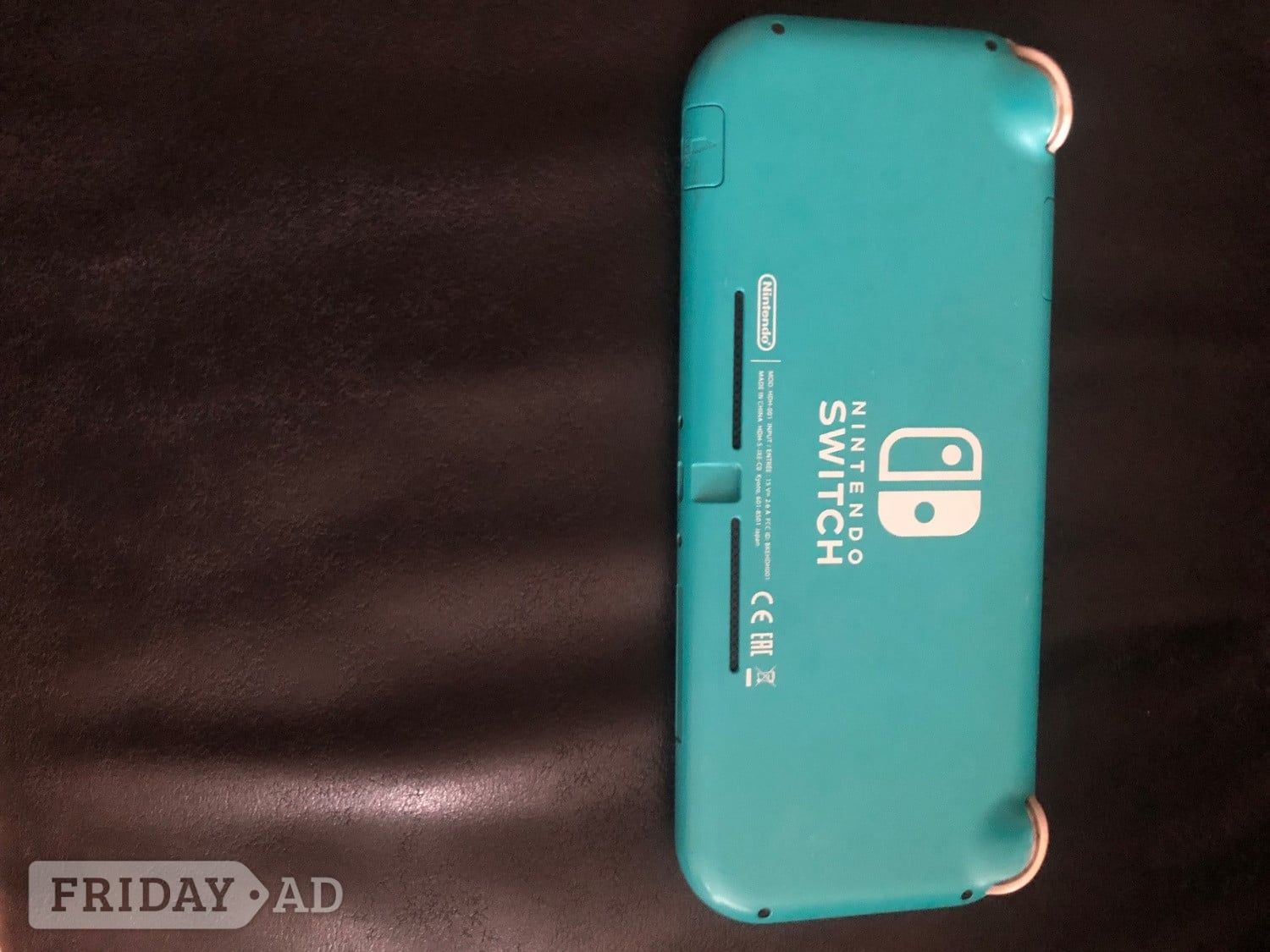 Nintendo switch lite- teal colour ( plus a ps4 controller) 