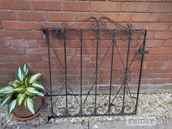 Black pedestrian wrought iron gate