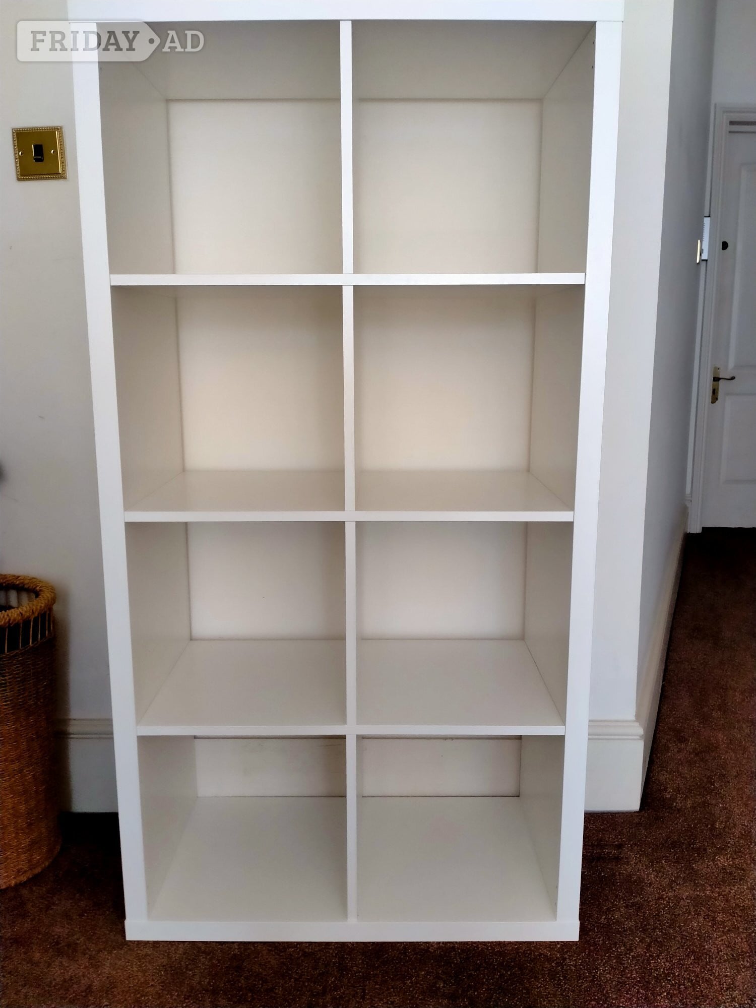 White cube storage unit with six assorted colourful storage boxes