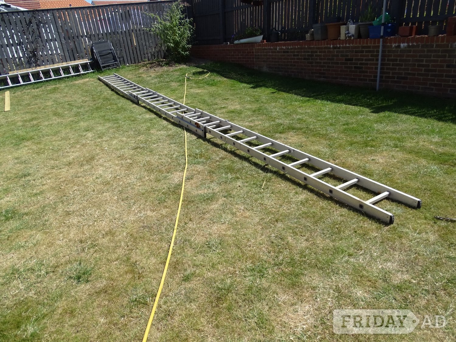Triple extending aluminium ladder for sale in Whitby