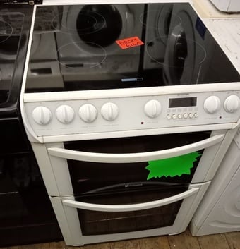 Hotpoint 60cm Wide Electric cooker with double oven and grill.