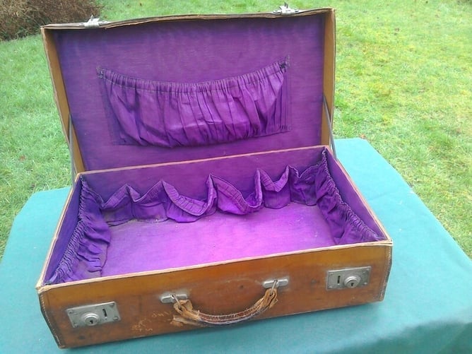 Suitcase, vintage, leather on cardboard?