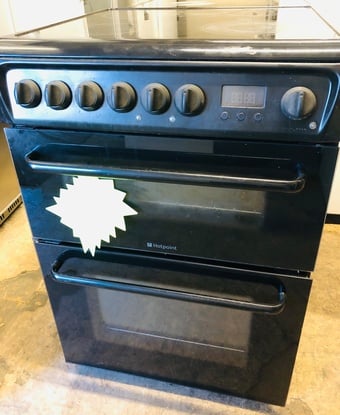 Black hotpoint 60CM Wide  Electric cooker with oven and grill.