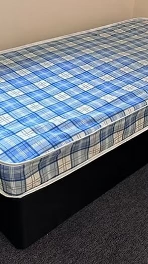 Single - Economy mattress with black divan base and headboard