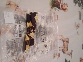 Black head band with yellow sun flowers