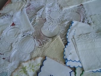 various collections of laces/crochets/embrodiery and the like. dressing table sets, runners  etc.
