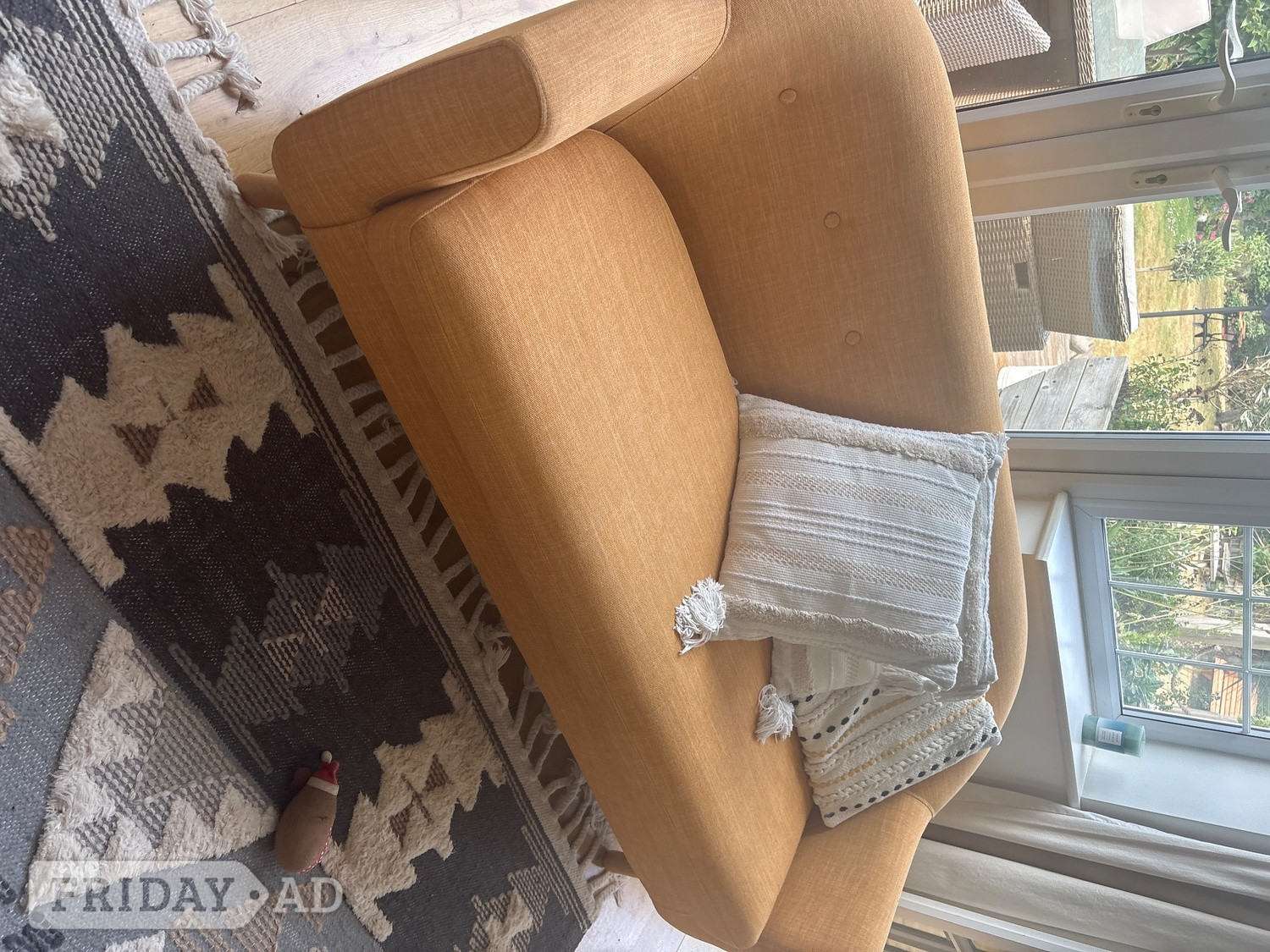 Mustard colour settee. Wooden legs dimensions 178cm x90 depth  in Worthing