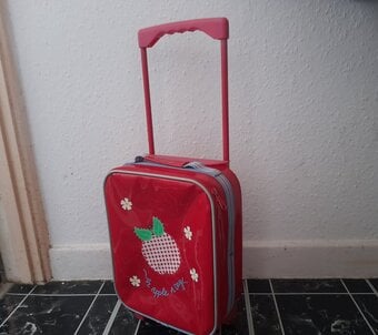 Girls red strawberry style pull along travel bag 