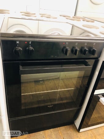 Black bush 60CM Wide Electric cooker with top oven and grill.