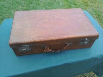 Suitcase, vintage, leather on cardboard?