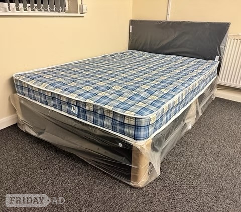 Rotherham 4 Foot Economy Mattress with black divan base and headboard
