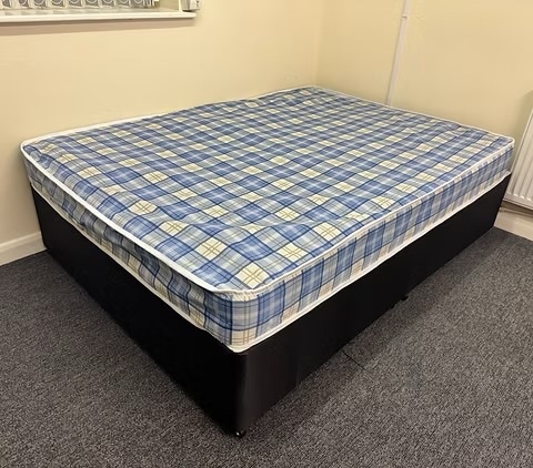 4 Foot Economy Mattress with black divan base and headboard