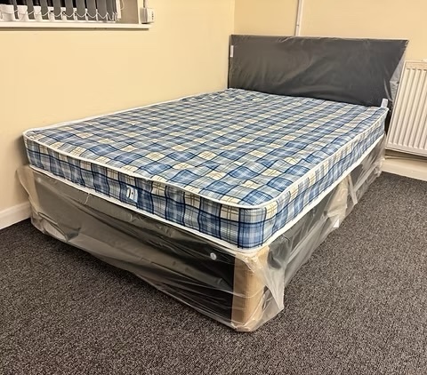Rotherham 4 Foot Economy Mattress with black divan base and headboard