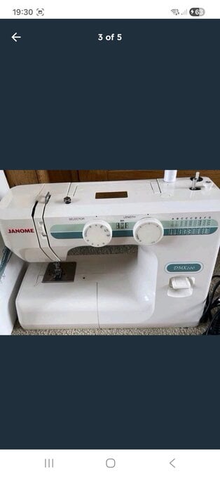 Janome DMX 200 sewing machine in new condition throughout 