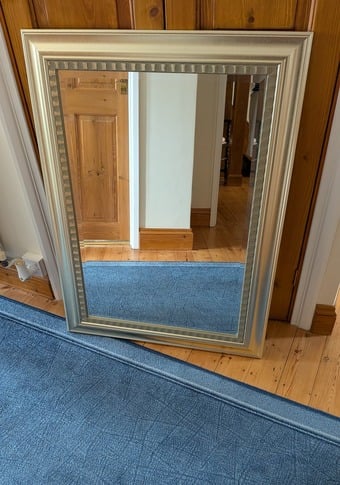 Large gold coloured mirror. 