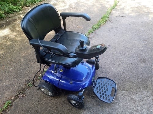 Power Wheelchair, will breakdown to fit in boot. 