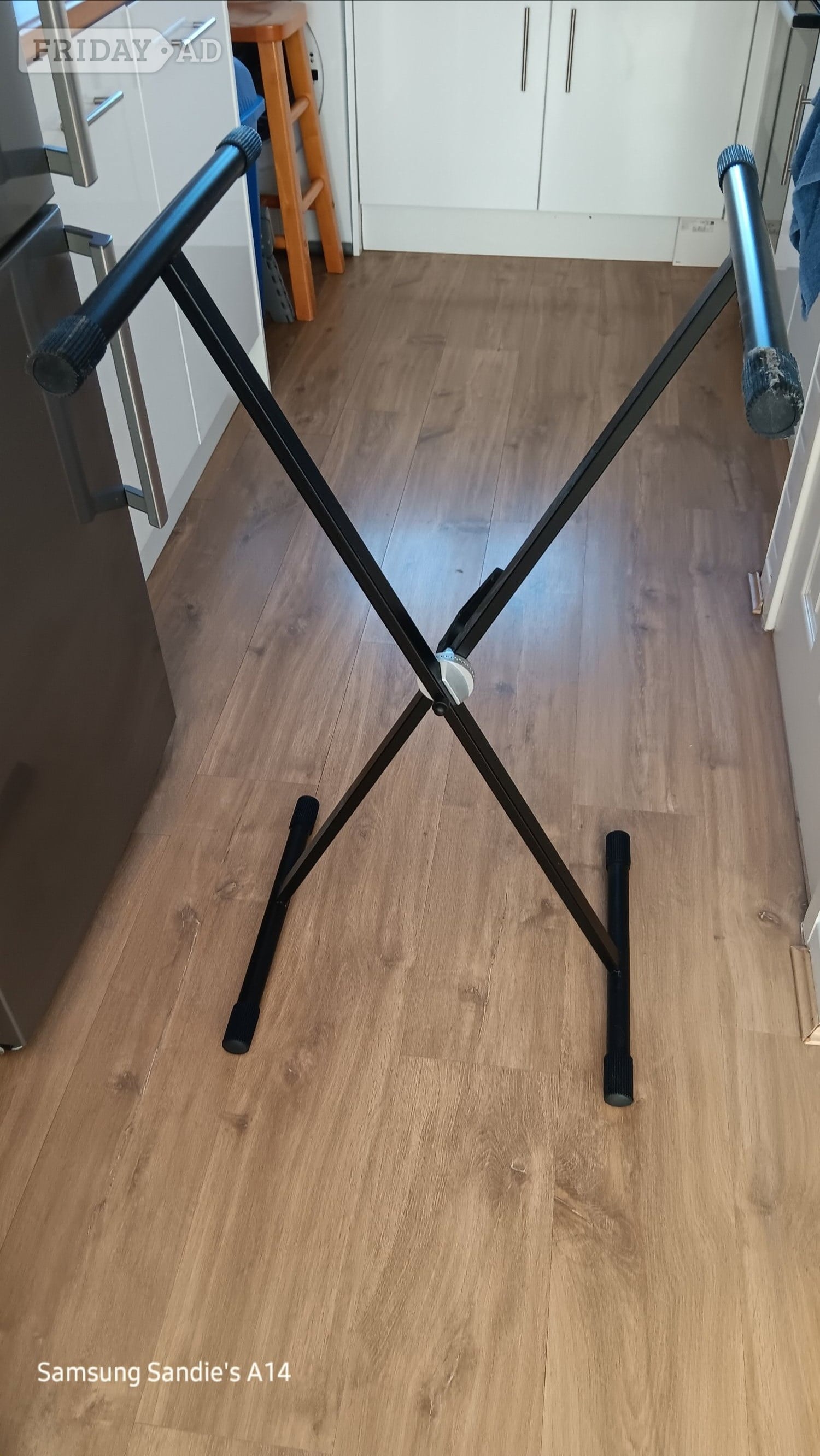 Keyboard Stand and 5 learning music books.