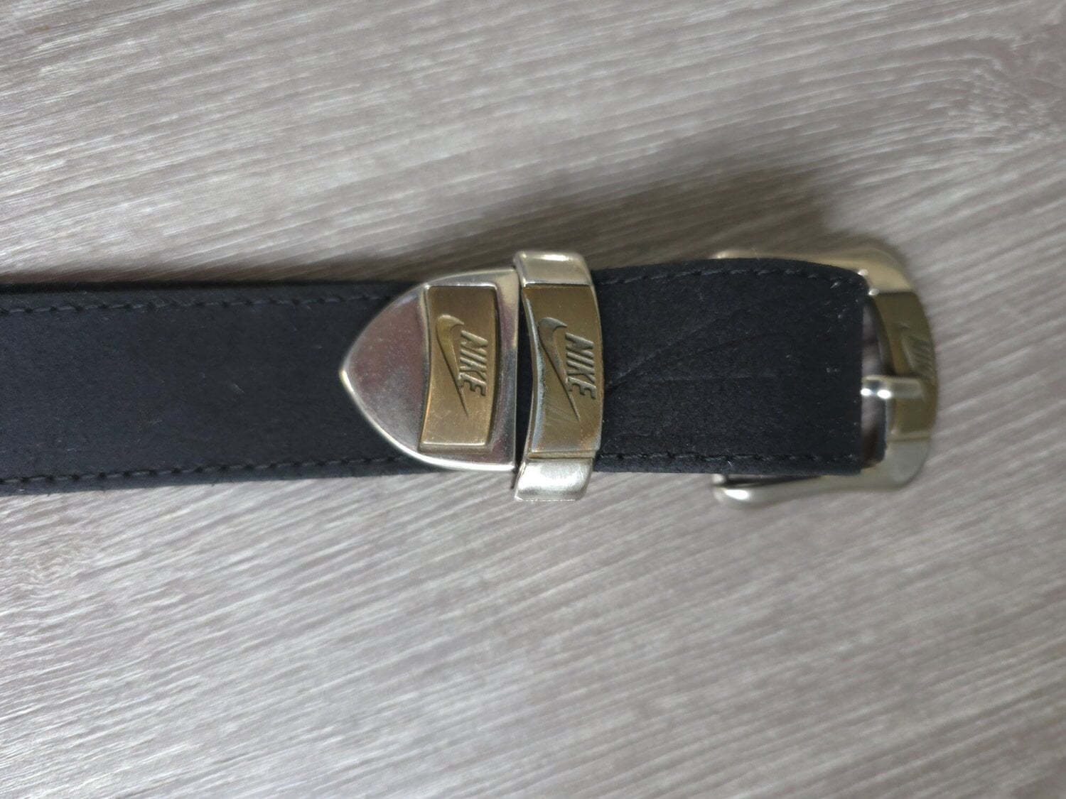 Vintage black Nike leather belt featuring an embossed Nike spello