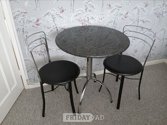 Small round kitchen table and 2 chairs.