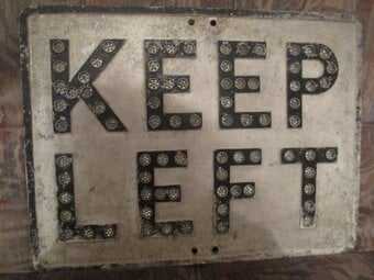 A VINTAGE BRITISH ROAD SIGN WITH REFLECTORS