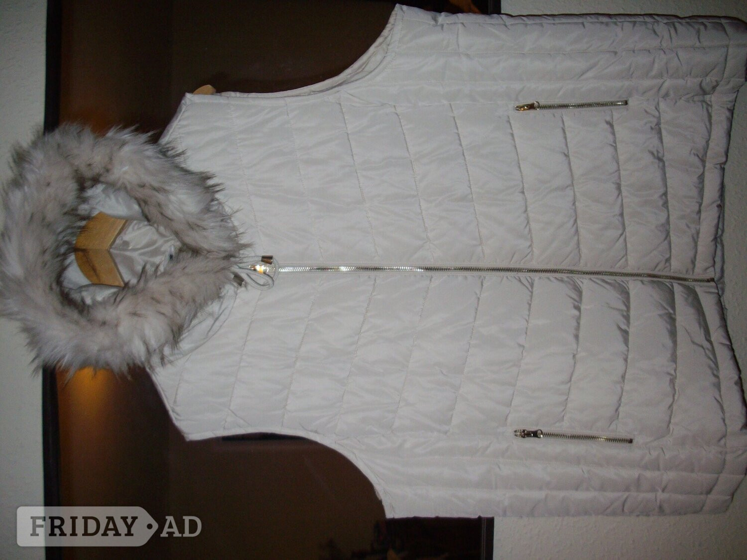sleeveless quilted jacket, hooded fur trim pull tie , zip pockets in Arundel