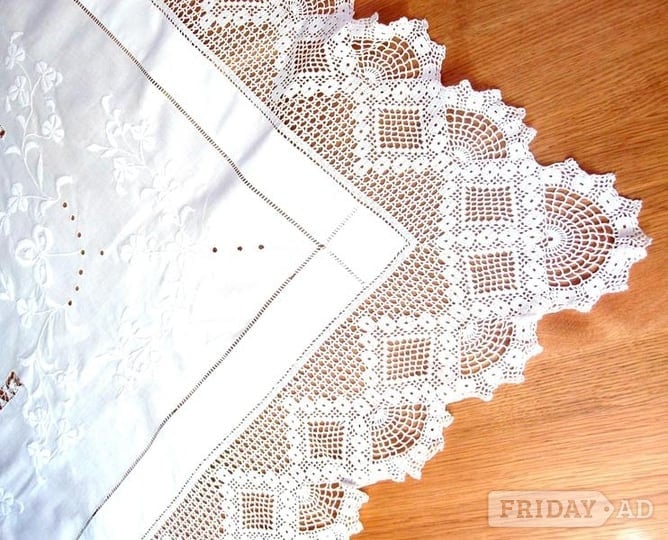 Tablecloth, white embroidered with lace surround.